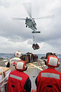 121002-N-TG831-324 PACIFIC OCEAN (Oct. 2, 2012) Sailors assigned to the Arleigh Burke-class guided-missile destroyer USS McCampbell (DDG 85) stand-by as an MH-60S Seahawk helicopter delivers cargo during a vertical replenishment at sea. McCampbell is part